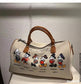 Bolsa de ombro temática Mickey: uma jornada pelo mundo