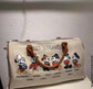 Bolsa de ombro temática Mickey: uma jornada pelo mundo